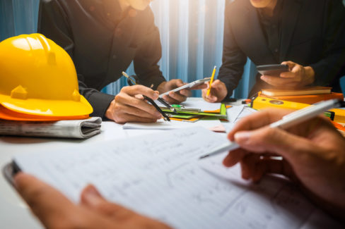 Teamwork of business man contractor working meeting in the office construction site on their architect project.