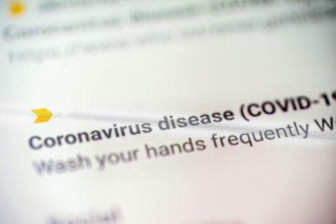 coronavirus disease covid 19 email message on smart phone screen