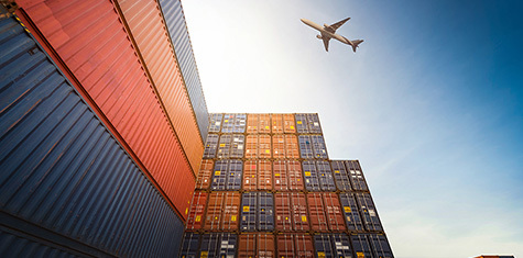 Stacked storage containers with airplane flying overhead