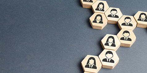 Connected wood hexagon pieces imprinted with generic faces