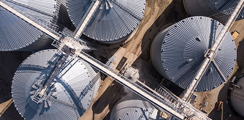 Overhead view of multiple grey silos
